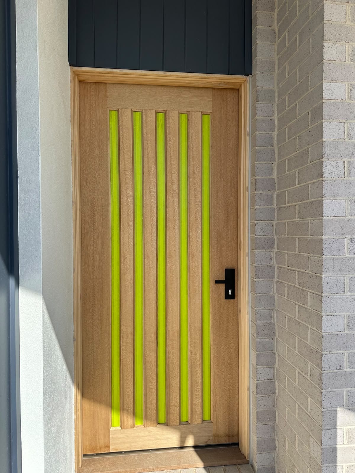 Natural grain timber entrance door prepared for rich oil finish