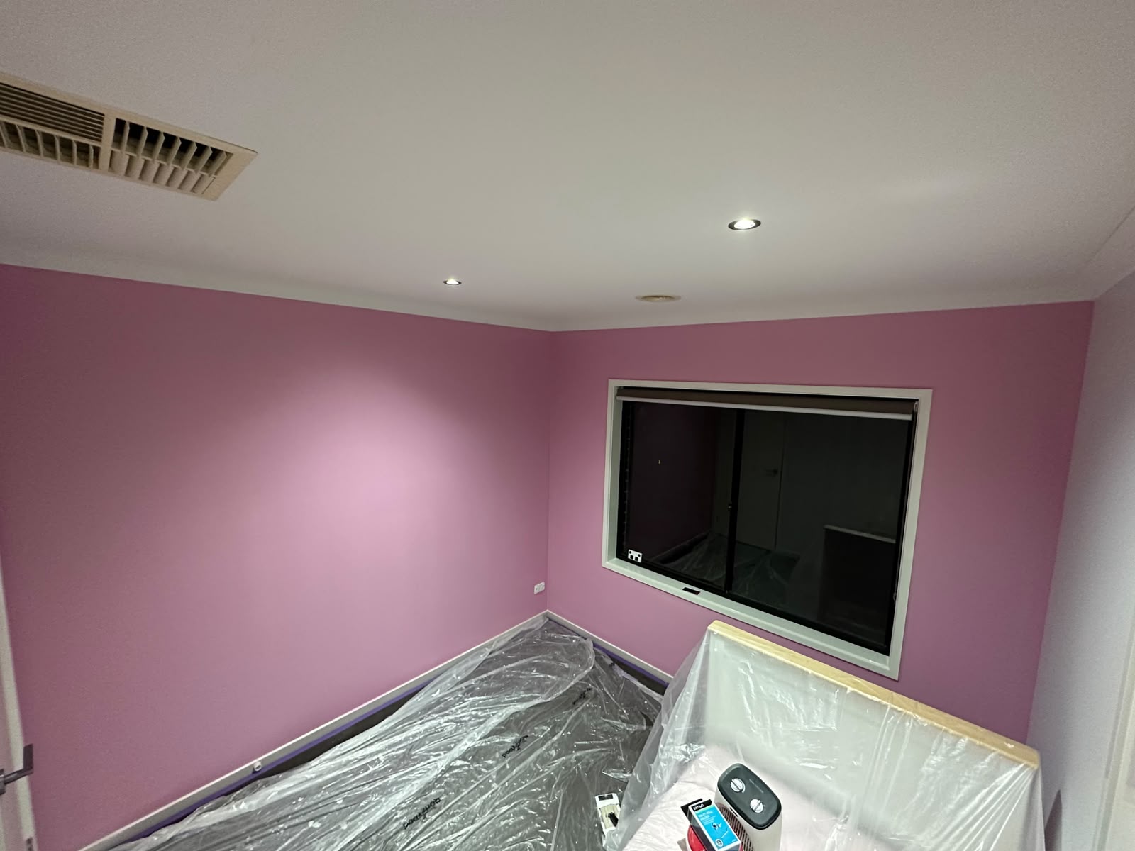 Master bedroom walls finished in soft mauve with satin white trims