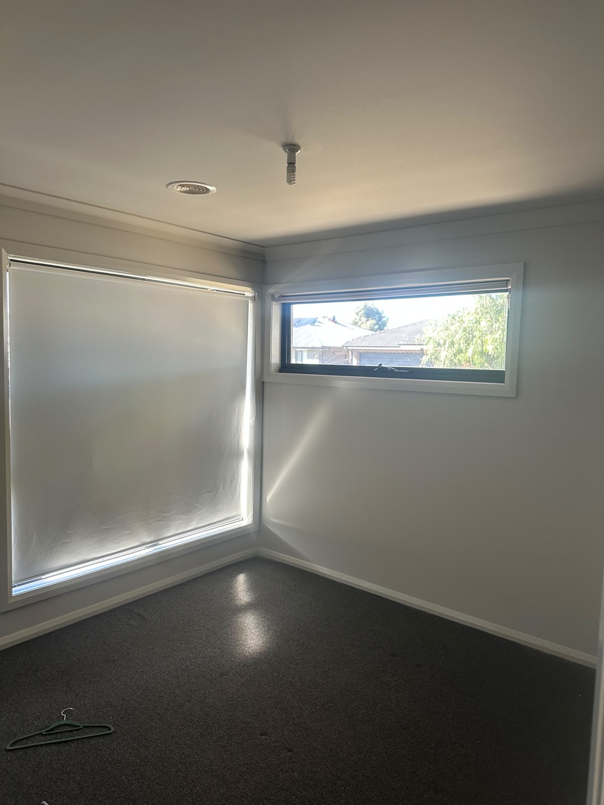 Bright sunlit bedroom walls finished in washable low-sheen acrylic