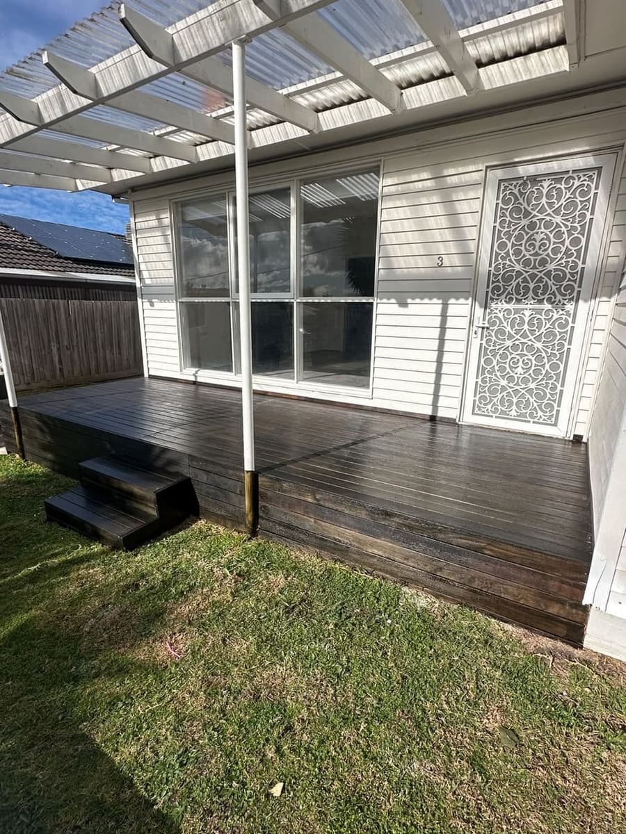 Front porch decking stripped back and stained in rich charcoal ebony