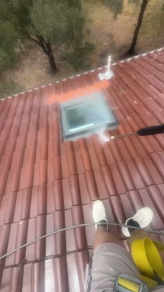 Airless spray application of protective roof membrane coating by ZN Painting Services